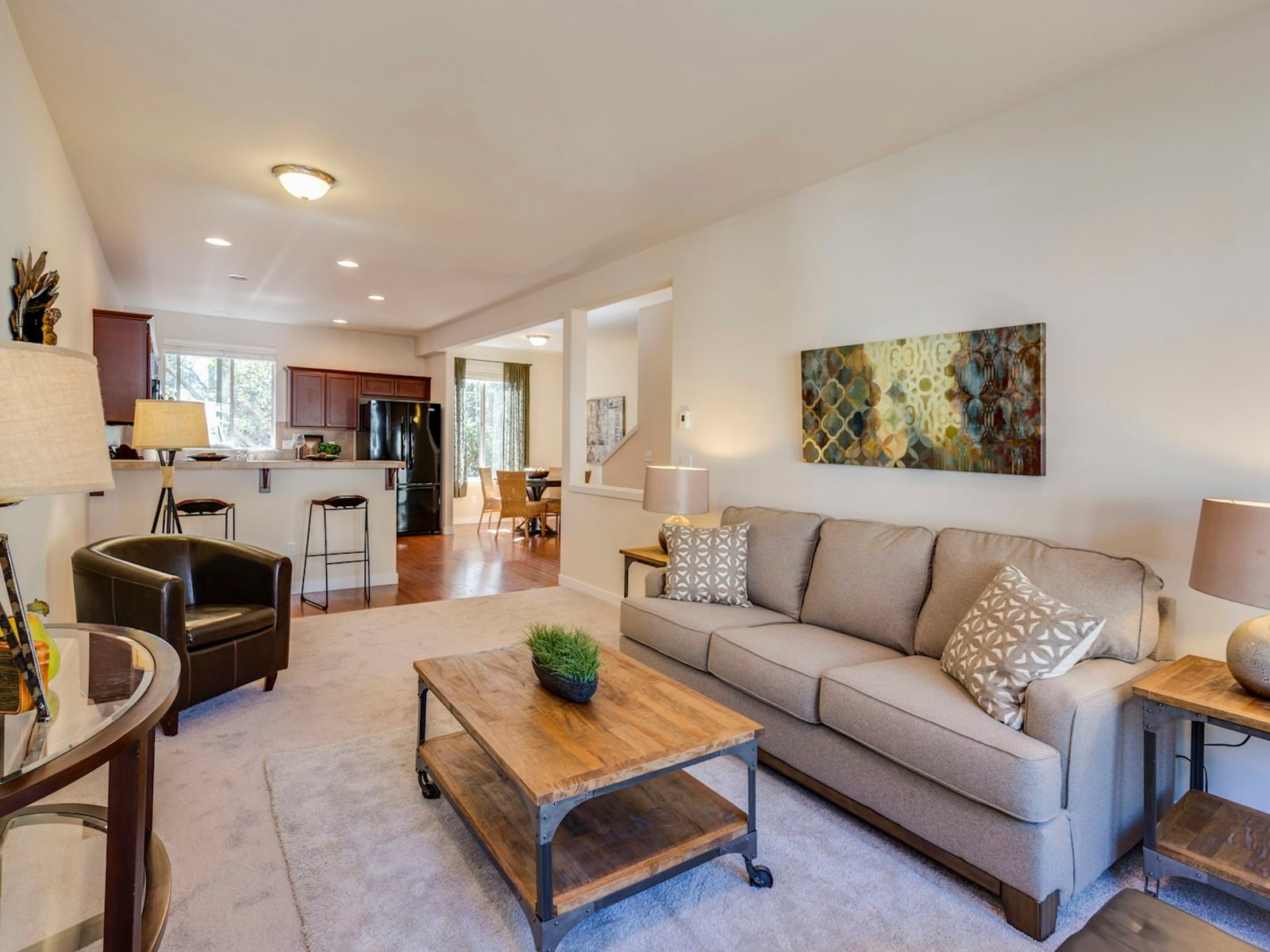 Bright, market-ready living room and open kitchen — the kind of space that shows well.
